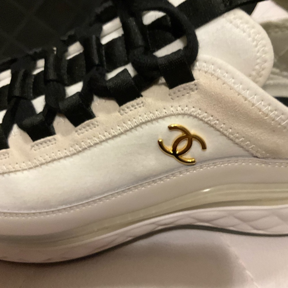 Beautiful Chanel sneaker.Comes with dust bag and extra lace and a box.